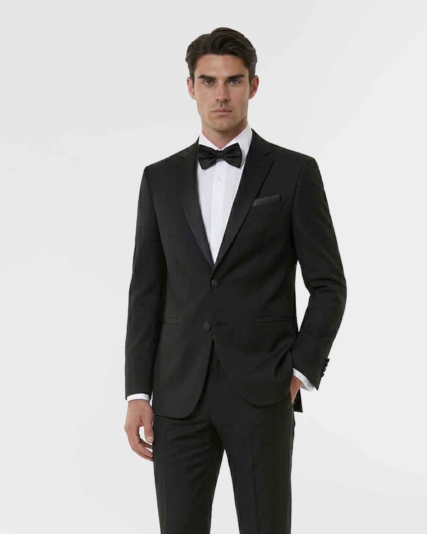 Man wearing a black wool modern-fit tuxedo from Hollywood Suits